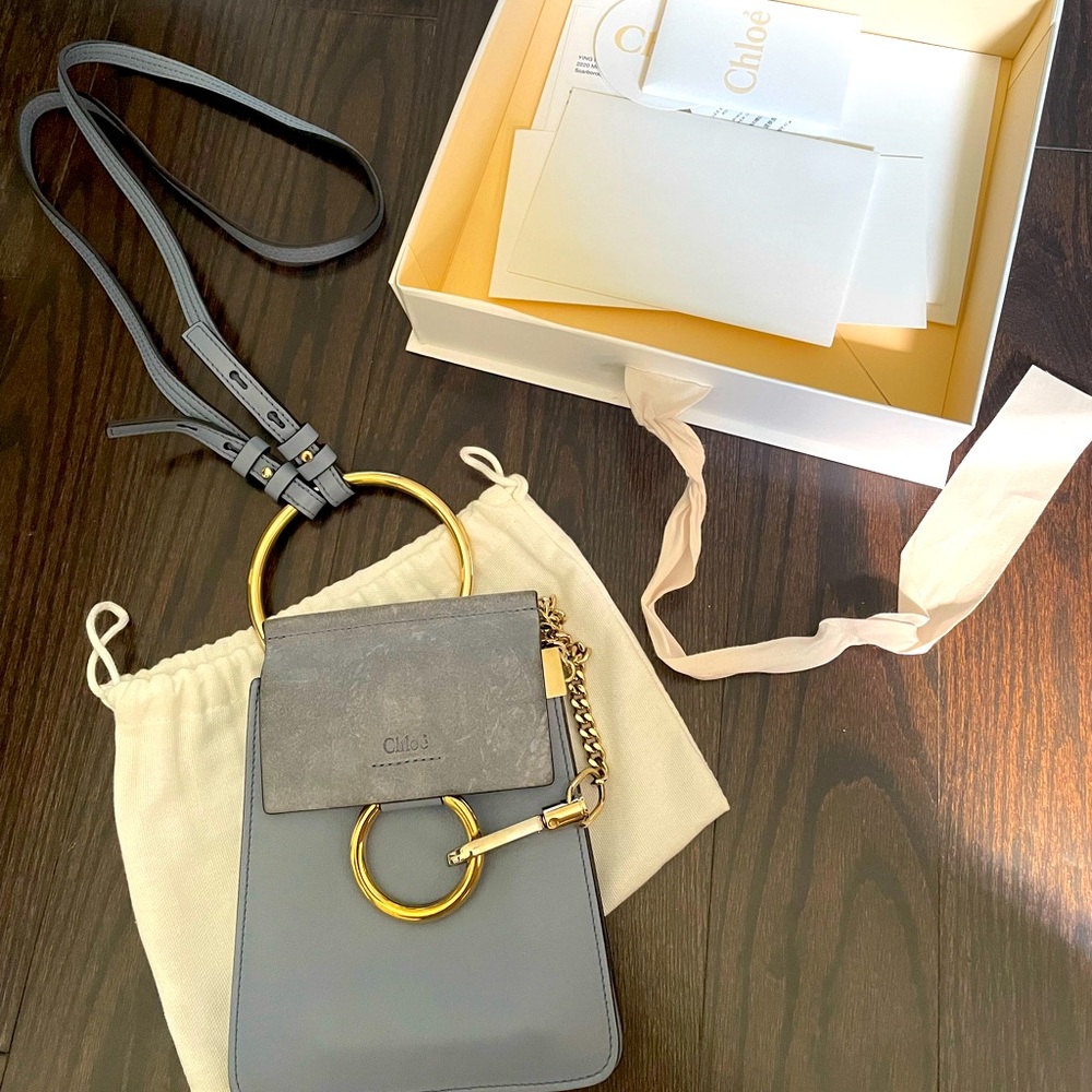 Chloe mini Faye bracelet bag. Color is a blue/grey